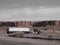 Truck in Utah desert with background of rock