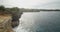 Truck view of the stunning steep cliffs near clear blue ocean on the Broken Beach Pasih Uug in Bali, Indonesia