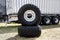 Truck wheels waiting to change. new truck tires on background of a large trailer.