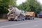 Trucks with concrete mixer stand on the asphalt along the route