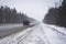 Trucks on the highway in dirty weather, Dangerous driving conditions in winter in cloudy weather.