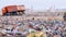 Trucks at a huge landfill.