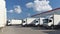 Trucks loading at a depot of a forwarding agency - Transport and logistics in goods trade