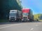 Trucks moving along a suburban highway