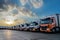 Trucks parked in a delivery companys yard, essential for transporting goods