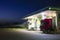 Trucks refuel at the gas station at night