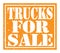 TRUCKS FOR SALE, text written on orange stamp sign