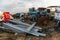 Trucks, tractors and other metal parts abandoned in a scrap yard near Sierra de Fuentes, Extremadura, Spain.