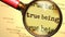 True being and a magnifying glass on English word True being to symbolize studying, examining or searching for an explanation and