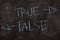 True or False written with color chalk concept on the blackboard