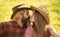 True feelings. Enjoying life. Love and harmony. Bearded cowboy in hat kissing adorable girlfriend. Couple in love