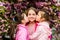 True friendship. Pink our favorite. Children spring garden. Sakura garden. Sisters friends sakura trees background. Kids