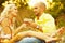 True romance concept. Weekend picnic. Portrait of a young loving couple in trendy casual clothes drinking red wine and enjoying