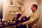 True romance doesnt fade with time. an elderly couple dancing with each other in their kitchen.