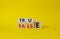 True vs False symbol. Wooden cubes with words False and True. Beautiful yellow background. Business and True vs False concept.