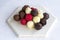 Truffle chocolate assortment on a white background. homemade chocolate pralines