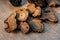 Truffles on a beige burlap. Thinly sliced mushrooms.Black raw champignons. Top view. Shallow depth of field.