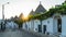 Trulli houses on Alberobello city at sunset time, Apulia, Italy