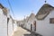 Trulli traditional Apulian hut. Street view in Alberobello, Puglia