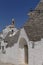 Trullo houses and church, Alberobello. Apulia.