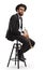 Trumpet player sitting on a chair and looking at the camera