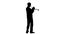 Trumpeter performs classical melody on the tool. Silhouette in studio