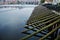 Trunk wooden barrage weir dam and wood barrier boat in Vltava river at Praha city in Prague, Czech Republic