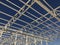 Truss ceiling and metal pillars and girders. Support constructions. Industrial building metal framework