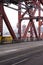 Truss of red metal Broadway bridge and Down Town of Portland on
