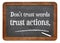 Trust actions, not words blackboard sign