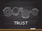 Trust with gear concept on chalkboard. Vector illustration.