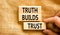 Truth builds trust symbol. Concept words Truth builds trust on wooden blocks on a beautiful canvas table canvas background.