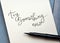 TRY SOMETHING NEW hand-lettered in notepad with brush pen