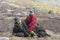 Tsaatan boy, dressed in a traditional deel, with his grandfather