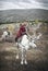 Tsaatan boy with his family reindeer in northern Mongolia