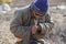 Tsaatan man carving a reindeer horn