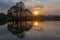 Tsaritsyno culture and recreation Park. Beautiful reflection in the water of the pond of trees and the setting sun