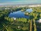 Tsarskoye Selo.  Catherine Park.  View of the grotto and the lake.  Dawn.  Summer.  Flying in the park.