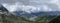 Tseylomsky pass in Ingushetia. A trip uphill to the Tsei Loam pass on a cloudy spring day. Panorama of the high cliffs