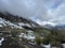 Tseylomsky pass in Ingushetia. A trip uphill to the Tsei Loam pass on a cloudy spring day. Panorama of the high cliffs