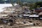 tsunami receding, revealing the shocking damage to coastal villages and towns