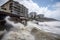 tsunami waves battering beachside hotels and resorts, causing massive damage to property and infrastructure