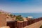 TTop view of luxury hotel resort on Dead Sea beach, blue sky and blue sea background.