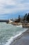 Tuapse, Russia, - December 26, 2020. Port of small town of Tuapse in south of Russia, people feed bread to arriving gulls, wild