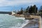 Tuapse, Russia, - December 26, 2020. Port of small town of Tuapse in south of Russia, people feed bread to arriving gulls, wild