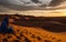 Tuareg looking at Erg Chebbi dunes, near Merzouga - Morocco