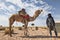 Tuareg man with  his camel