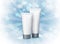 Tube of cosmetic product on blue background with bokeh effect. Winter skin care