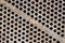 Tube sheet plate of heat exchanger or boiler closeup texture macro diagonal background with insoluble hard mineral