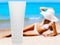 Tube of sun lotion with slim tanned woman on a beach behind.